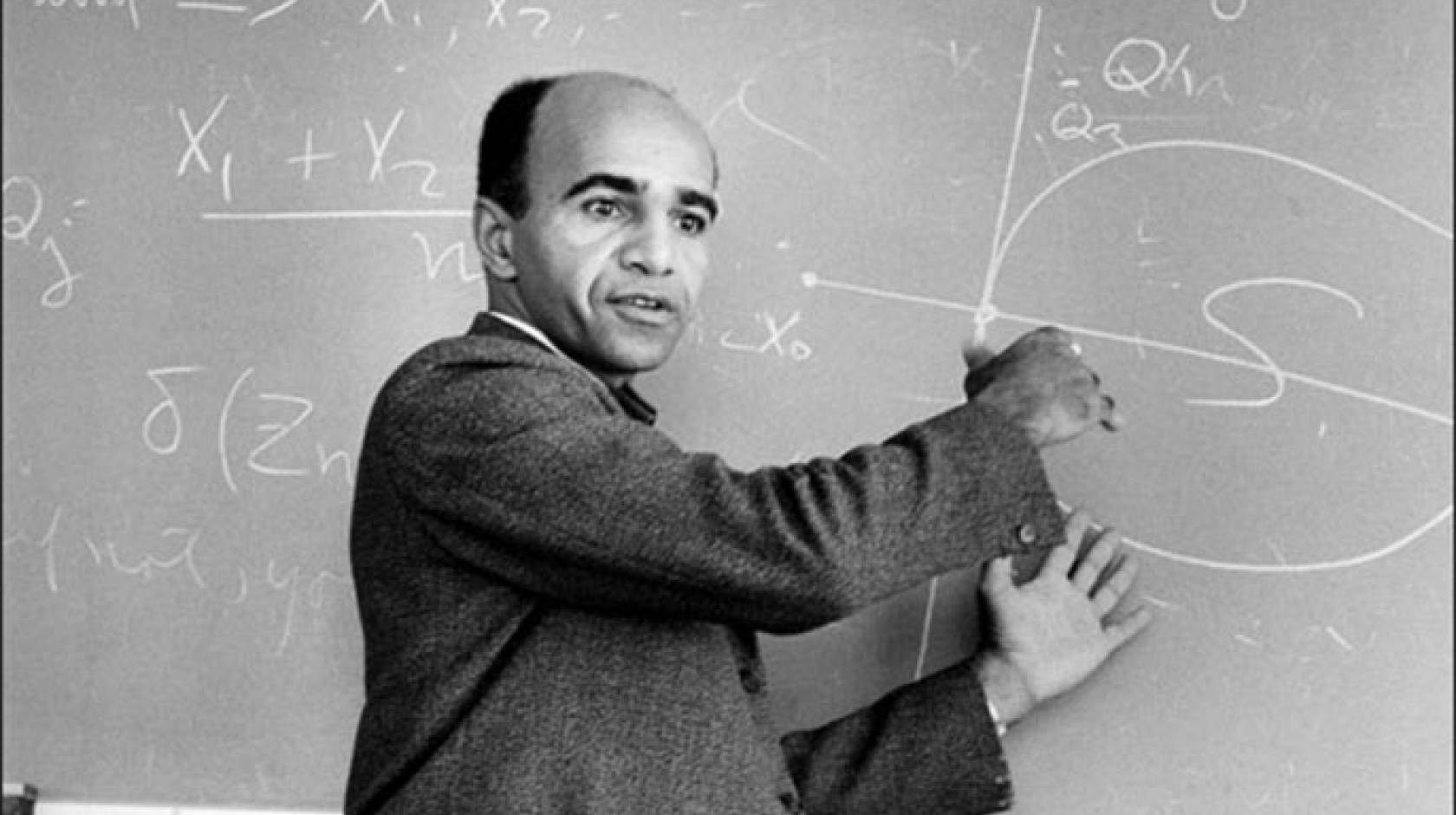 David Blackwell teaching at a chalkboard covered with mathematical notation